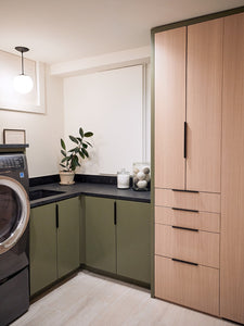 Clever Built-Ins Hide All the Clutter in This Basement Laundry Room