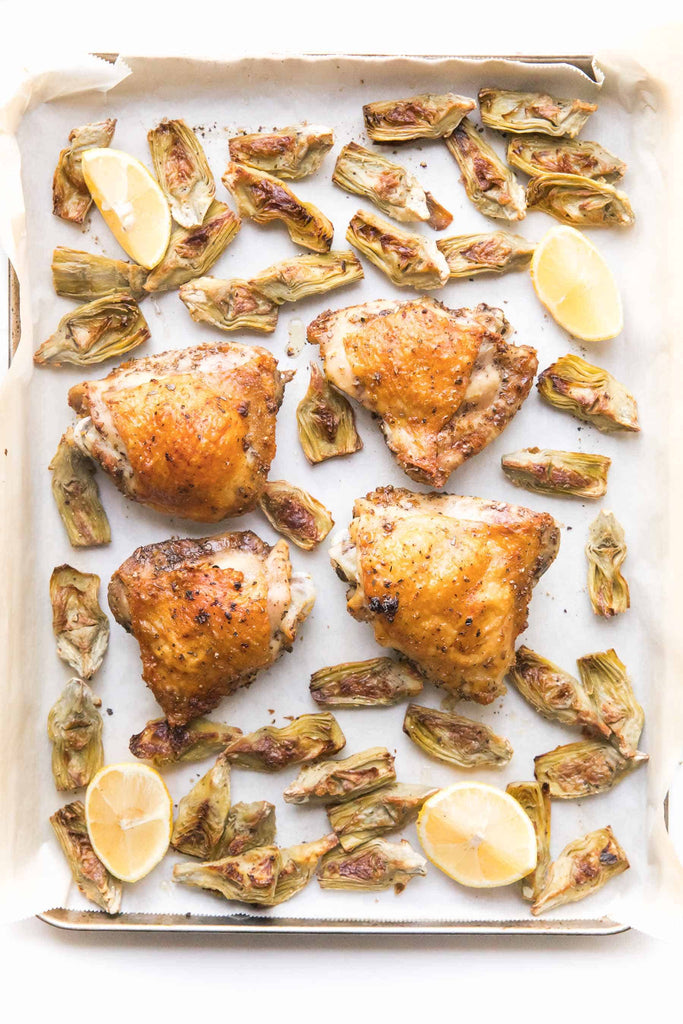 Whole30 + Keto Sheet Pan Greek Chicken Recipe – crispy chicken thighs in a greek marinade + artichoke hearts