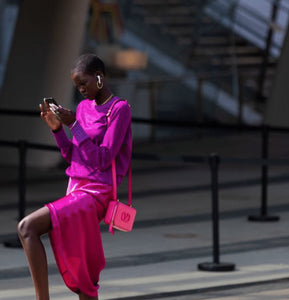 *Image above of supermodel Adut Akech Bior, looking impossibly chic while possibly pausing to lock in an Amazon Prime deal, which today includes a discount on the Apple Airpods she’s wearing above.